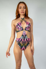 Model wearing a colorful Monarch O-Ring Bodysuit, showcasing rave outfits and versatile rave clothing style.