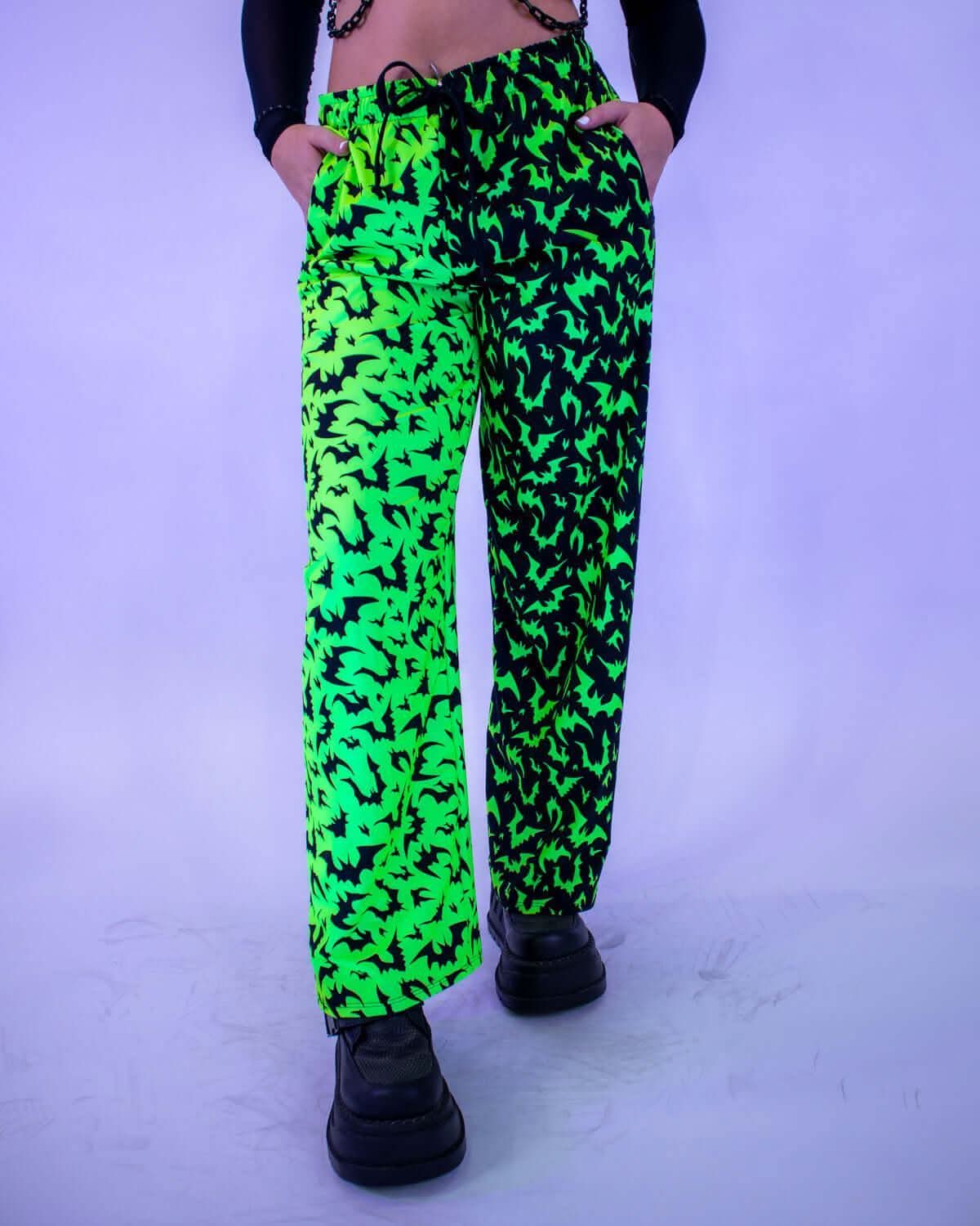 OG Batty 50/50 Lucy Pants - UV Green featuring neon lime and black bat patterns, perfect for rave outfits.