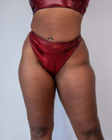Phoenix Retro Thong Bottoms in sparkly red, high hip cut design for rave outfits, showcasing a cheeky style and eye-catching materials.