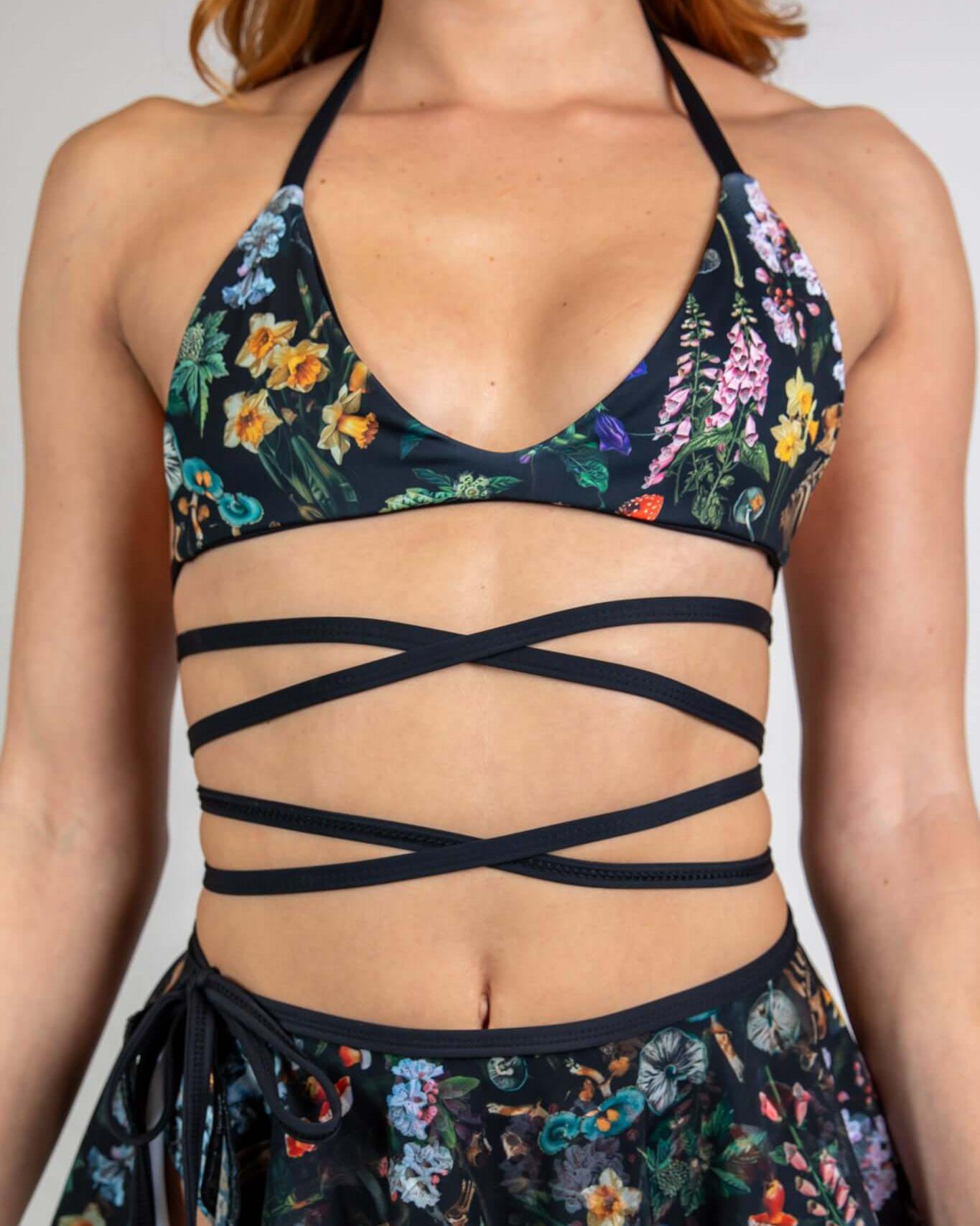 Poison Extra Mile Bralette with bold floral print and wraparound straps, ideal for rave outfits and festivals.