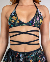 Poison Extra Mile Bralette with bold floral print and wraparound straps, ideal for rave outfits and festivals.
