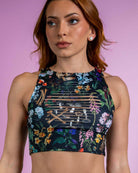 Poison Slit Crop Top with bold floral and skull print, perfect for edgy rave outfits, featuring unique slit details.