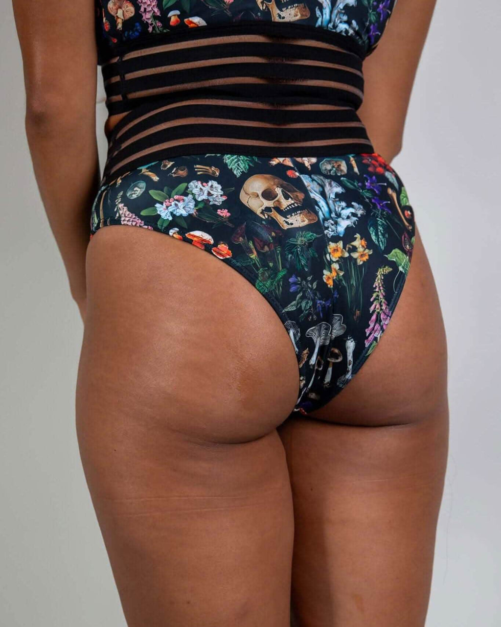 Poison Sporty Bottoms with edgy skull and plant print, high-waisted fit, perfect for rave outfits and stylish comfort.
