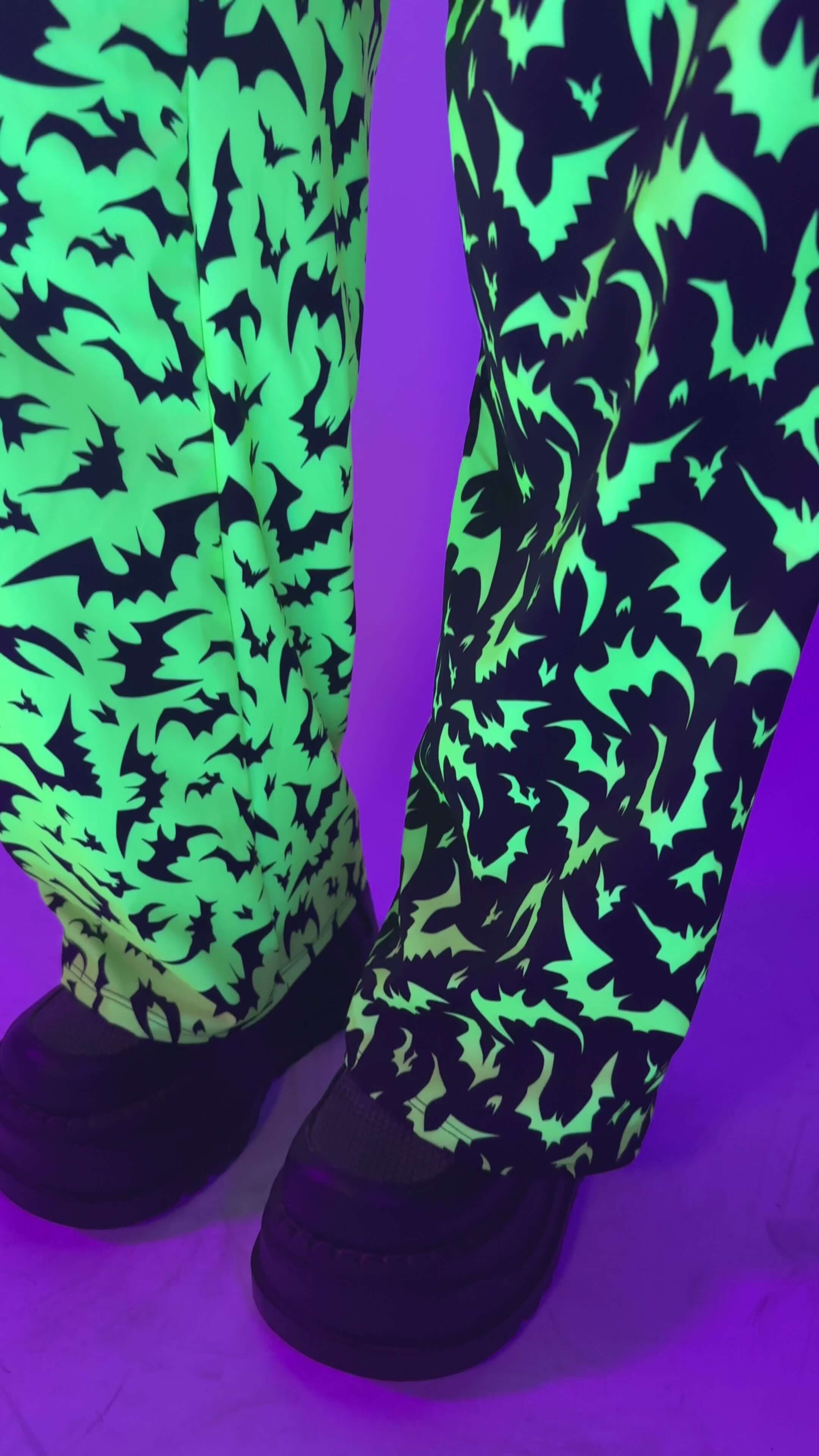 OG Batty 50/50 Lucy Pants - UV Green glowing under blacklight, ideal for rave outfits with electric bat patterns.