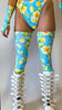 Video of a floral rave outfit from Freedom Rave Wear: blue and yellow high-waisted bottoms, matching thigh-high leggings, and white platform boots.