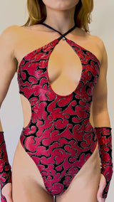 Freedom Rave Wear Inferno gloves and bodysuit in red with bold black patterns add vibrant style to rave outfits. Perfect for standing out.