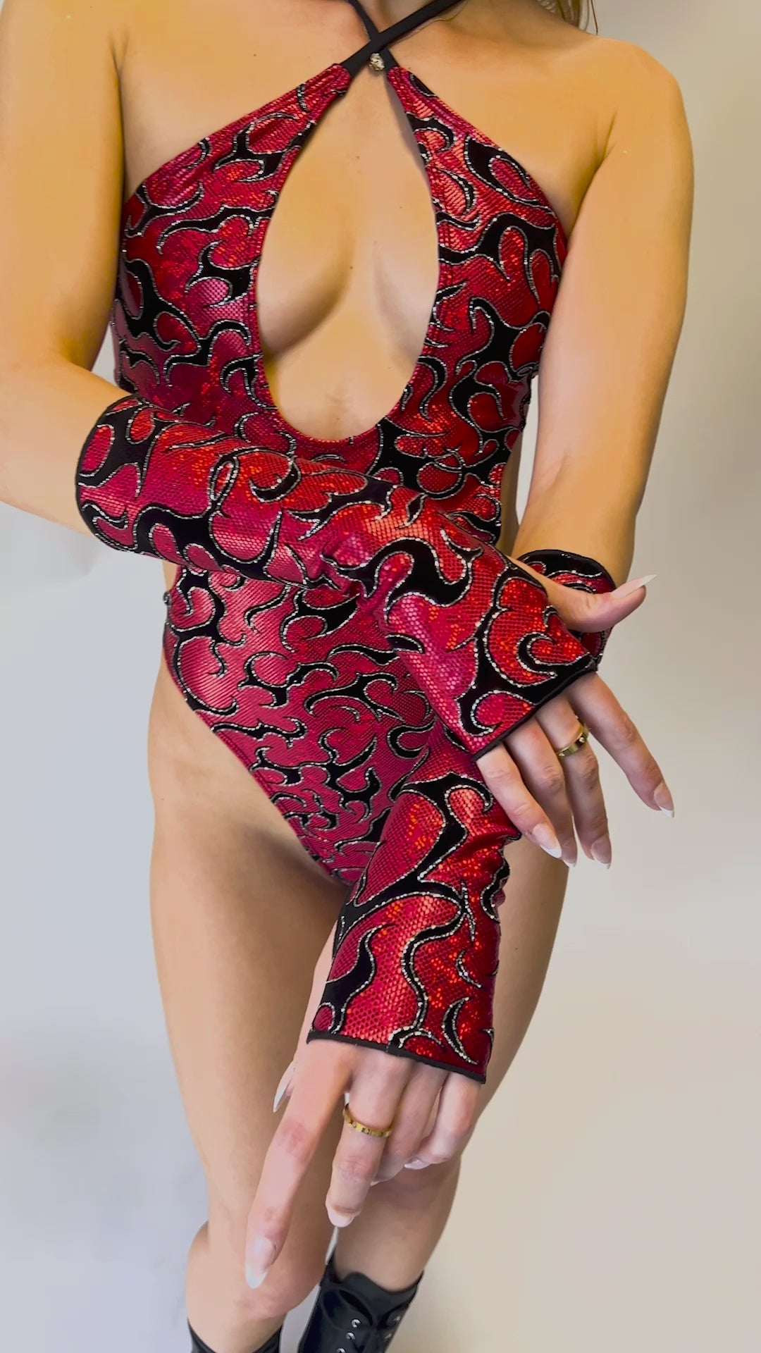 Freedom Rave Wear Inferno gloves in red with bold black patterns add vibrant style to rave outfits. Perfect for making a unique statement.