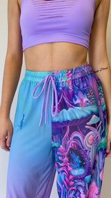 Freedom Rave Wear drawstring pants with vibrant mushroom and fairy print, perfect for adding a colorful and magical touch to rave outfits.