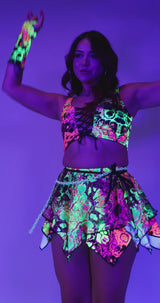 Model wearing a vibrant neon Intensity Fairy Skirt and matching top, ideal for rave outfits and festival fun.