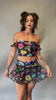 Video of Freedom Rave Wear sheer mini skirt with vibrant psychedelic mushroom prints, perfectly pairs with matching tops for rave outfits.