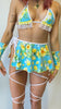 Video of Freedom Rave Wear's yellow floral blue tie skirt paired with matching lace-trimmed bikini top, bottoms, and strappy leg accessories.