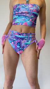 Freedom Rave Wear high-waist bottoms with vibrant mushroom print and lace-up sides, perfect for a colorful and bold rave festival outfit.