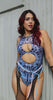 Model wearing the Chromium Keyhole Bodysuit, featuring a holographic cyber sigalism print and a bold keyhole cutout.