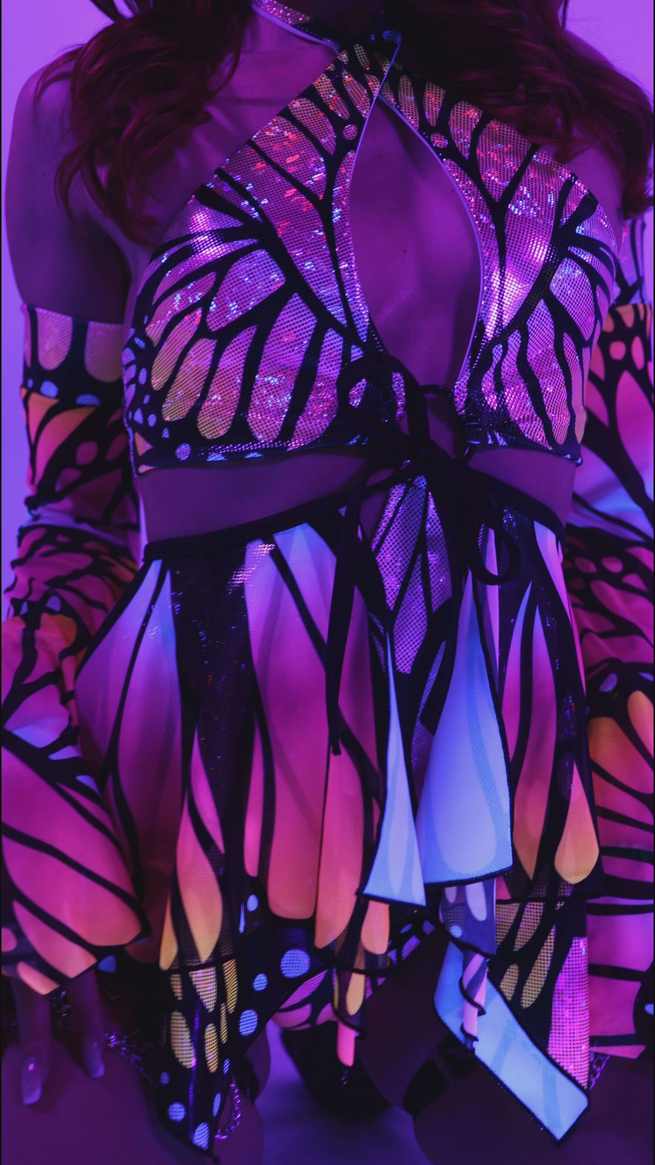 Monarch O-Ring Bodysuit with colorful butterfly design, perfect for rave outfits and versatile rave clothing.