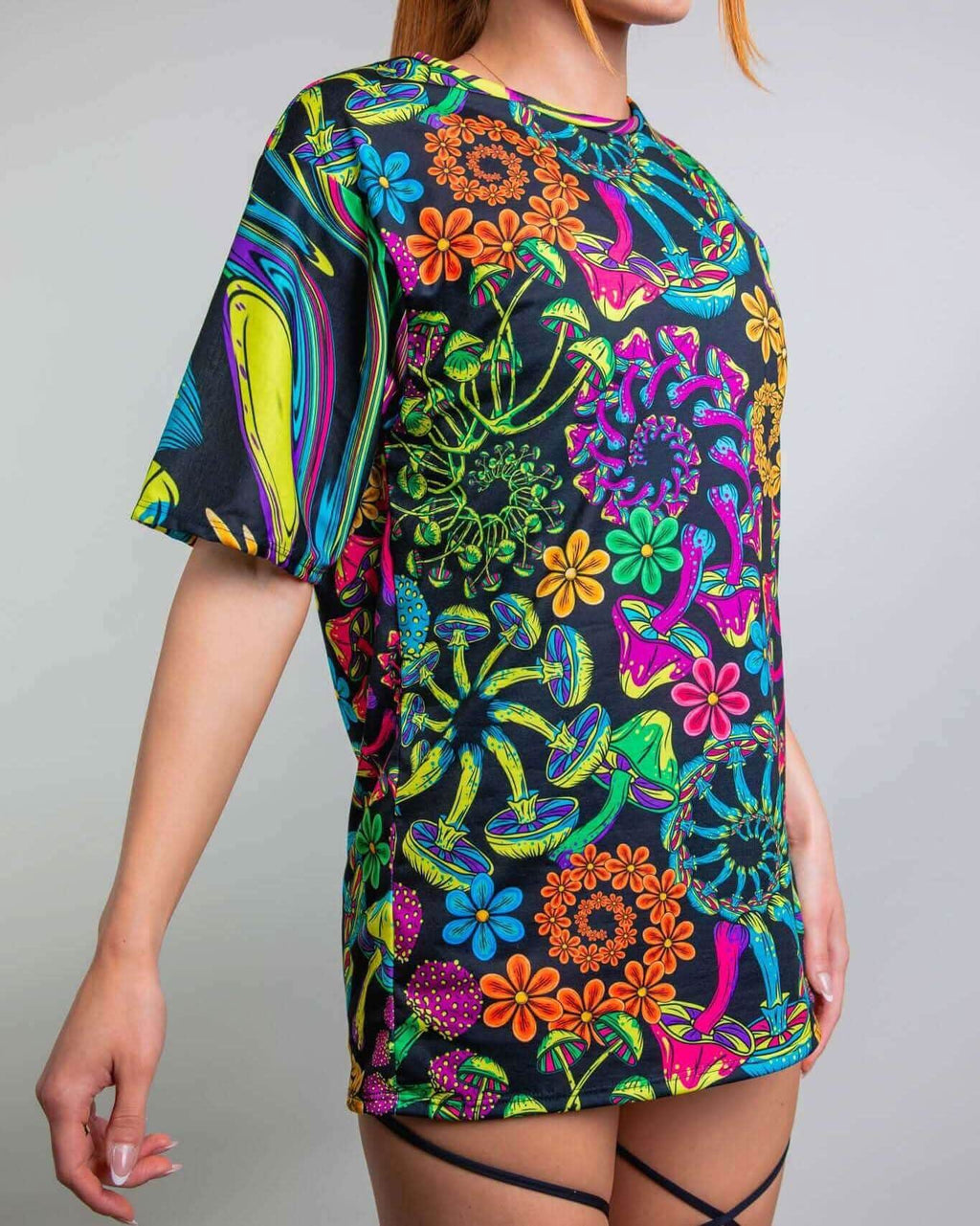 PsyBloom Oversized Tee with vibrant mushroom print, perfect for rave outfits, modeled by a woman in stylish poses.