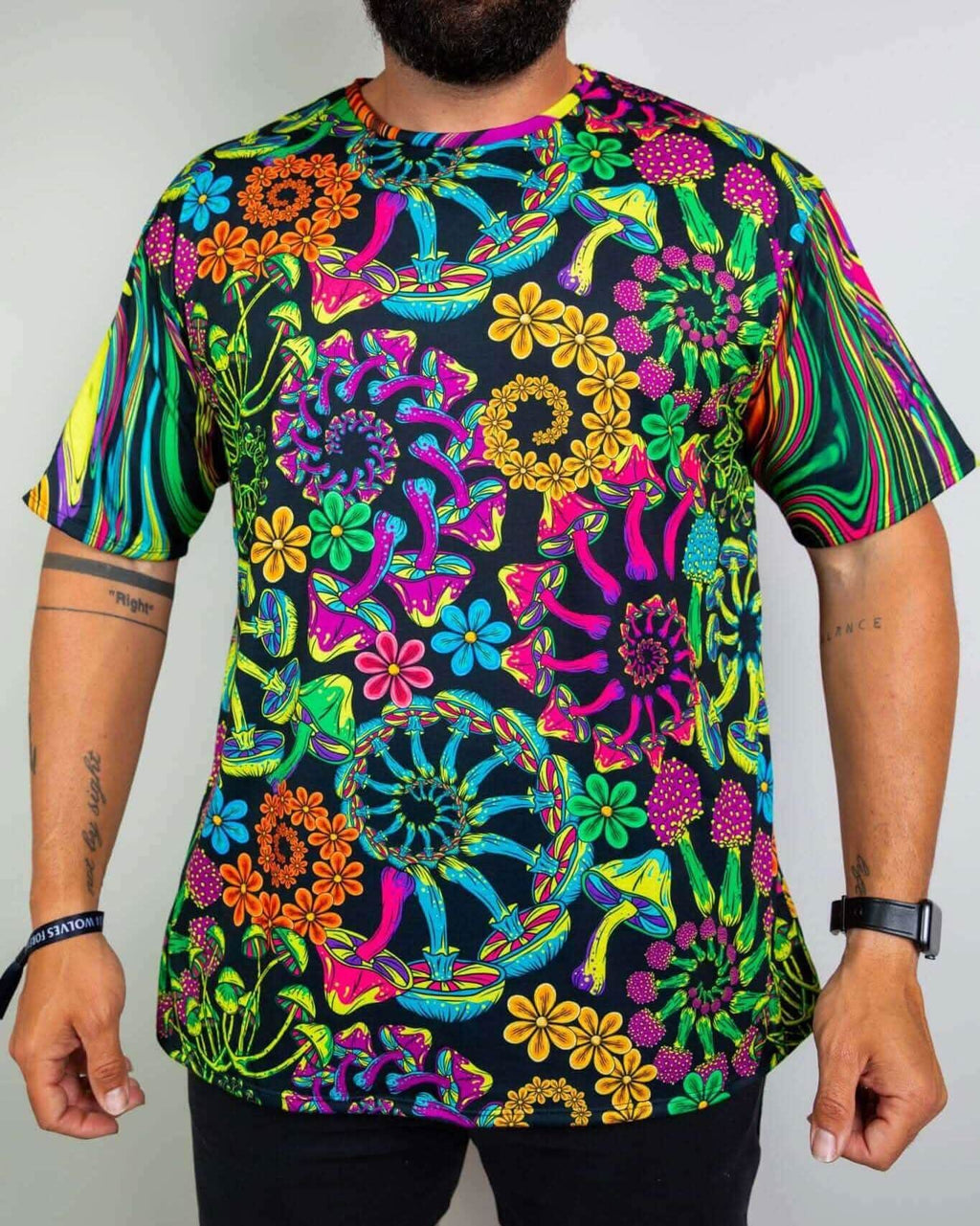 PsyBloom Oversized Tee featuring colorful mushroom and floral patterns, perfect for rave outfits and festive occasions.