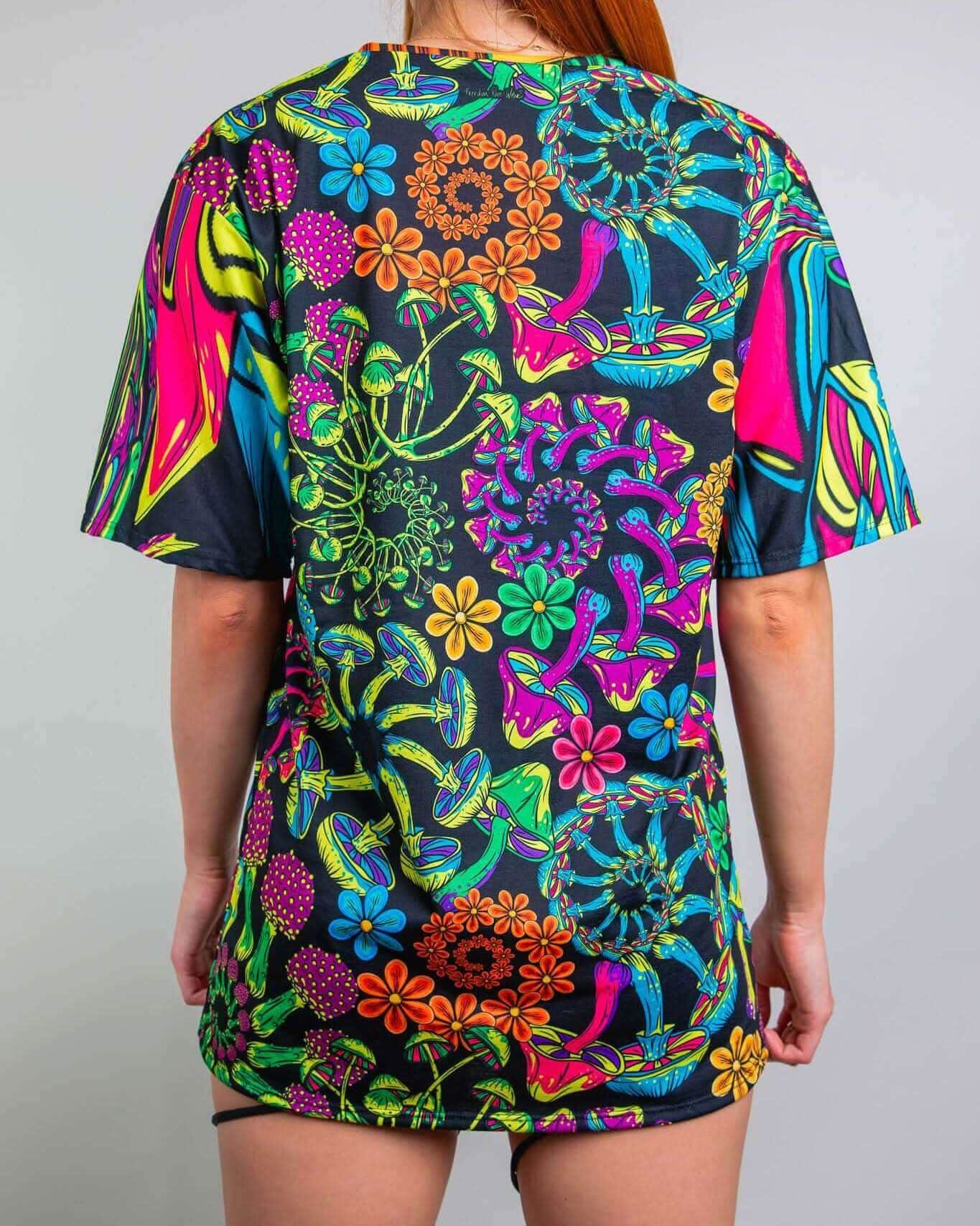 Back view of the PsyBloom Oversized Tee featuring a vibrant, colorful mushroom and flower print, perfect for rave outfits.