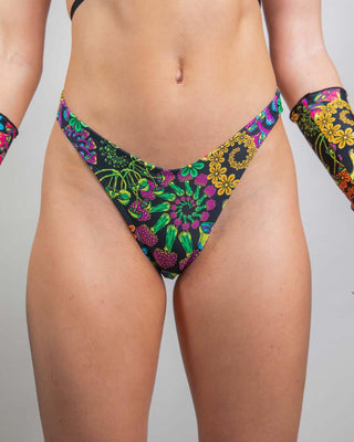 PsyBloom psychedelic thong bottoms with vibrant floral print, perfect for rave outfits and standing out in the crowd.