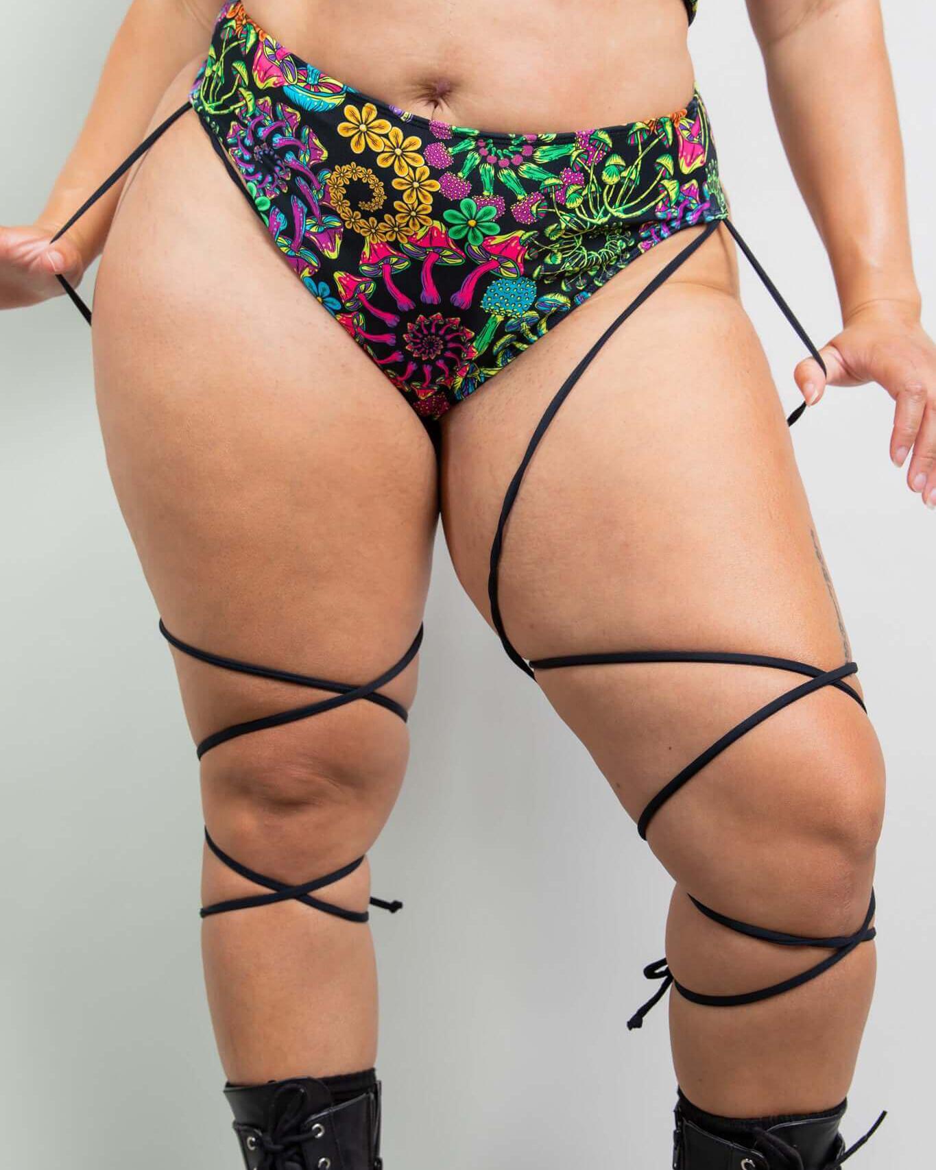 PsyBloom Strappy High Waisted Thong with vibrant floral print and side straps, perfect for rave outfits.