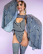 Rave arm sleeves in black white distortion mesh bell sleeve design modeled with matching festival outfit