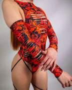 Woman modeling Forbidden dragon print rave arm sleeves with strategic slits in red orange colorway front view