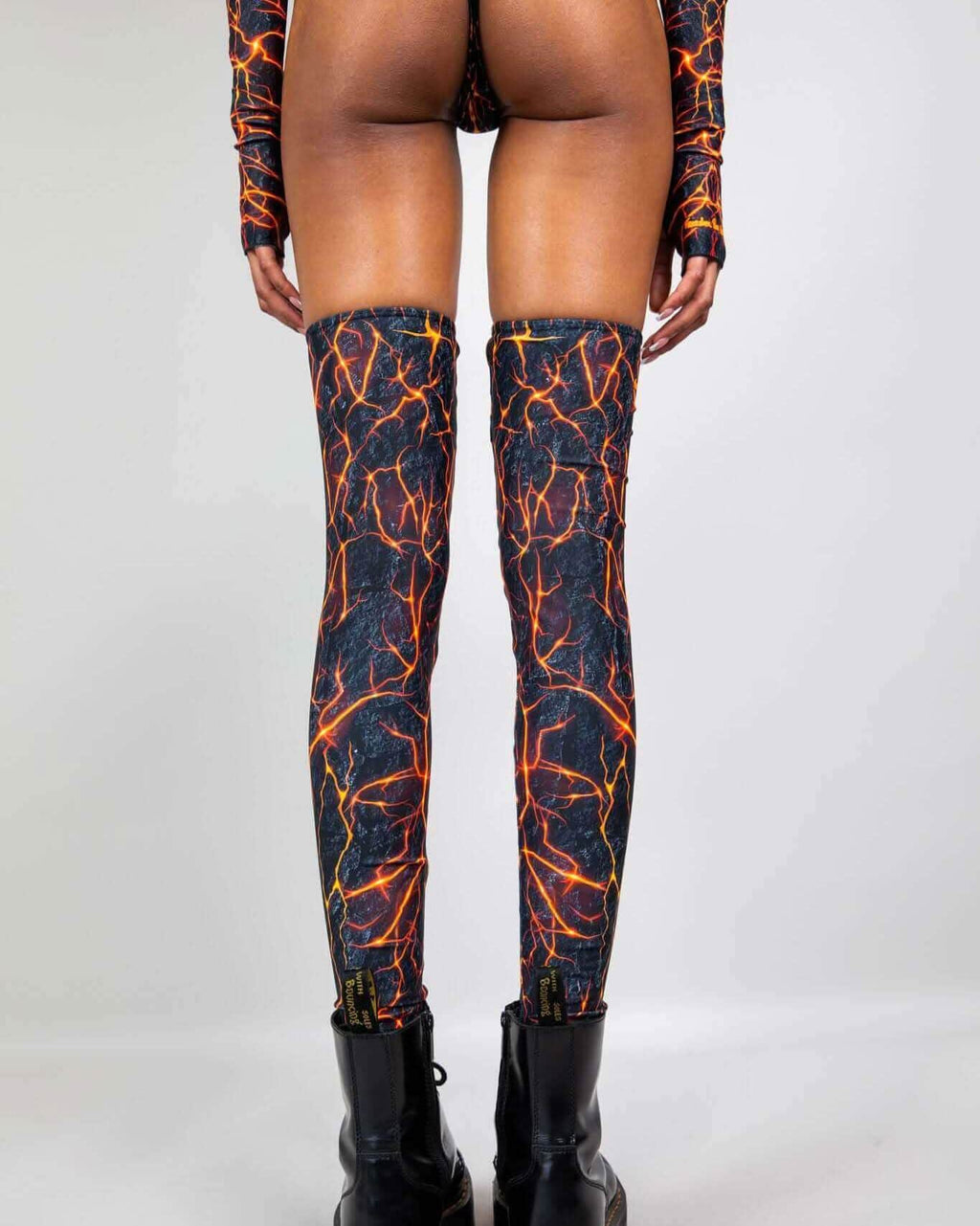Rave arm sleeves and leg sleeves set in magma flame print, back view festival outfit styling