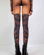 Rave arm sleeves and leg sleeves set in magma flame print, back view festival outfit styling