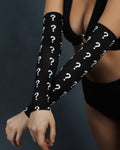 Mystery rave arm sleeves with question mark pattern worn by model in crossed arms pose for festival outfit