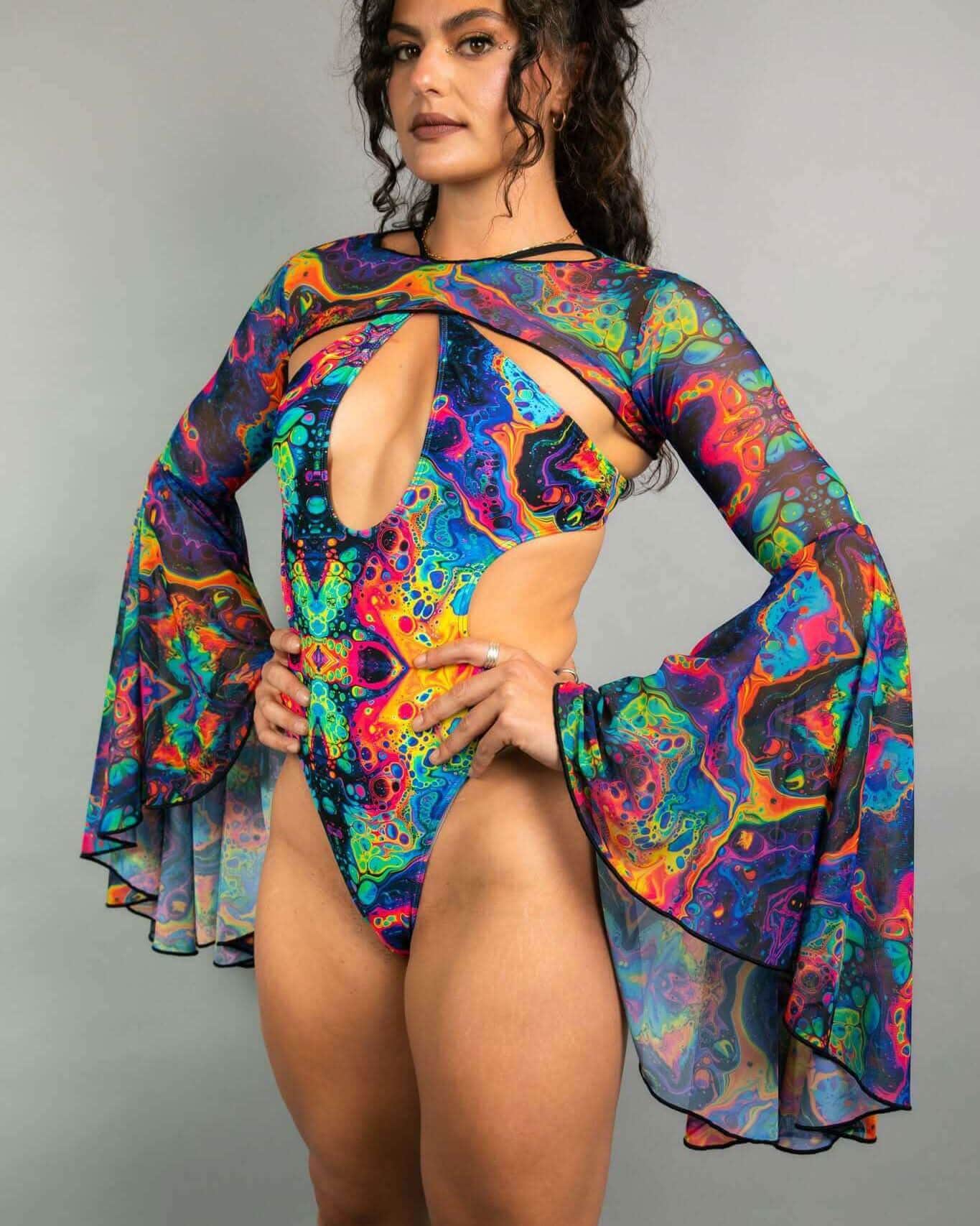 Model wearing Vivid Mesh rave arm sleeves with psychedelic swirl pattern festival outfit front view