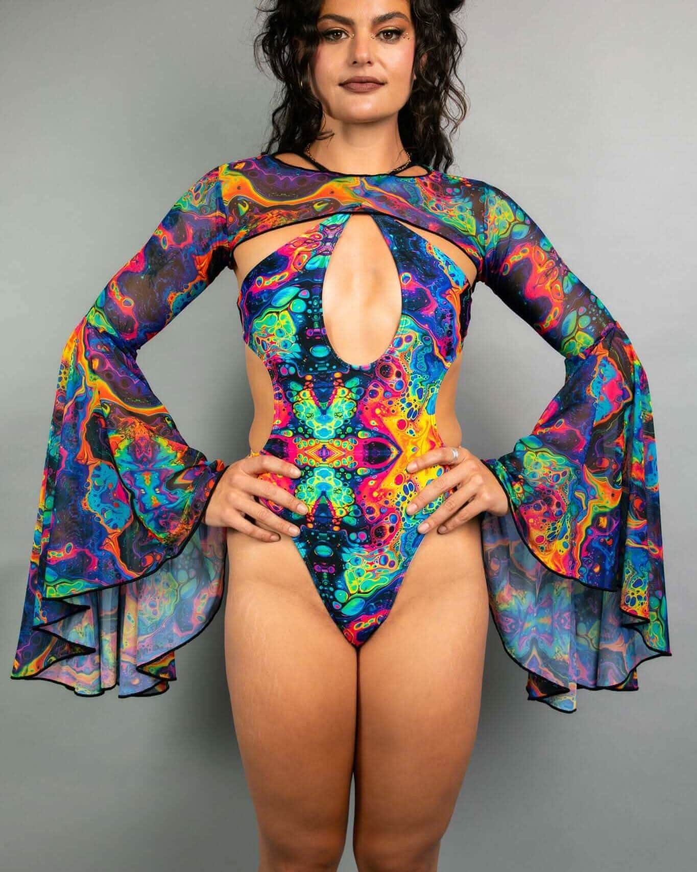 Woman modeling Vivid Mesh rave arm sleeves with flowing bell design in psychedelic rainbow colors for festival outfit