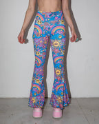 Groovy Bell Bottoms in a psychedelic pattern featuring smiley faces and rainbows, perfect for rave festivals