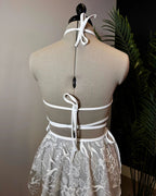 Seraphina Wrap Bikini Top in white, shown from the back on a mannequin, highlighting the intricate strap and tie details, perfect for a rave or festival.
