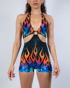 Blaze Romper front view, featuring vibrant orange and blue flame pattern on a black rave bodysuit.