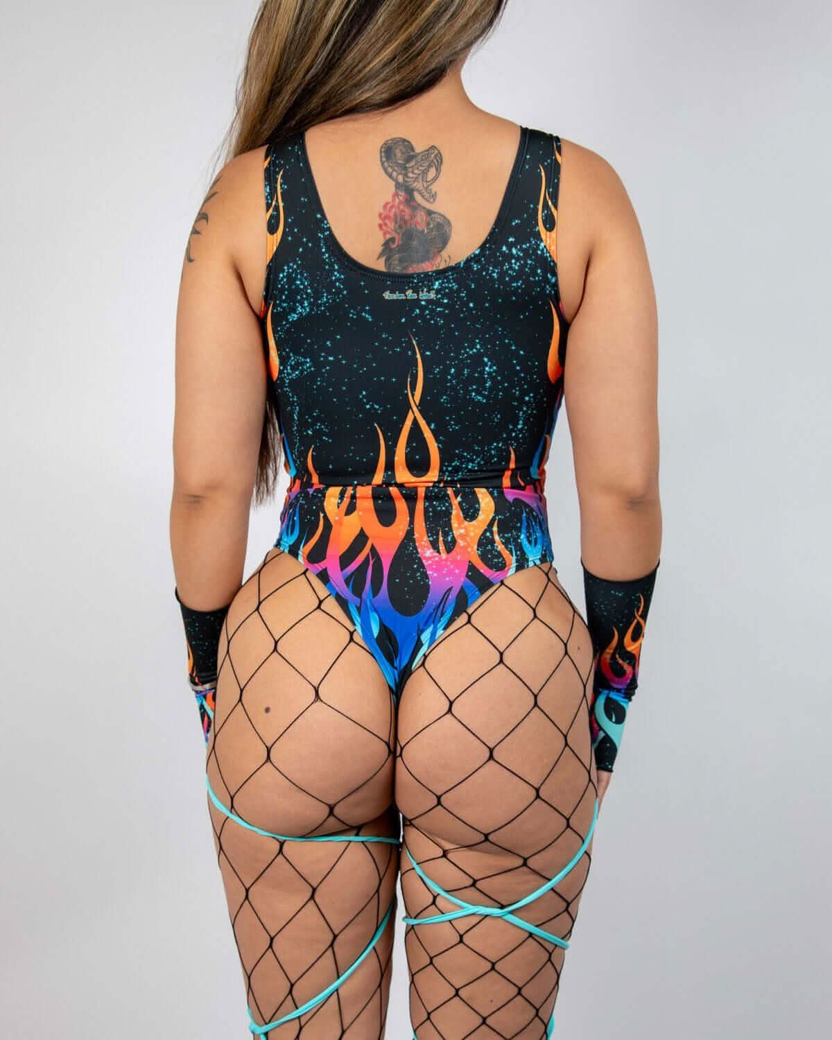 Back view of Blaze rave bodysuit with colorful flame pattern and galaxy speckled design on model
