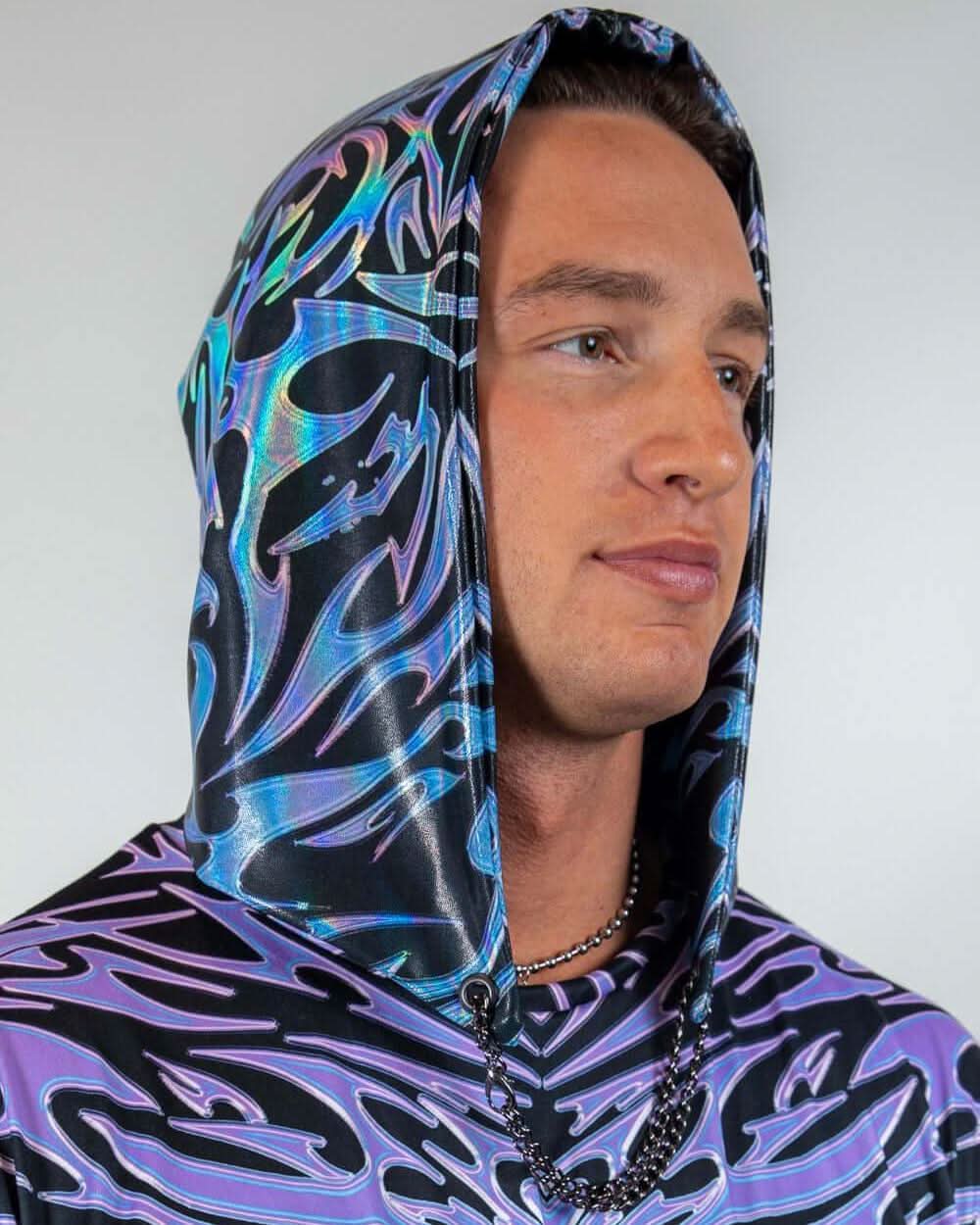 Male model in Chromium Assassin rave bodysuit hood with holographic pattern, side view studio shot