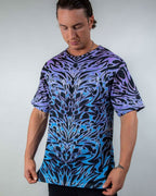 Male model in Chromium oversized rave bodysuit style tee with purple blue gradient tribal print front view