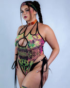 Cross Faded rave bodysuit in neon green and pink with black strappy details, festival outfit front view