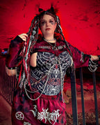Gothic rave bodysuit in Darkness Temptation print with skeletal design, festival outfit styled with chains and dramatic makeup
