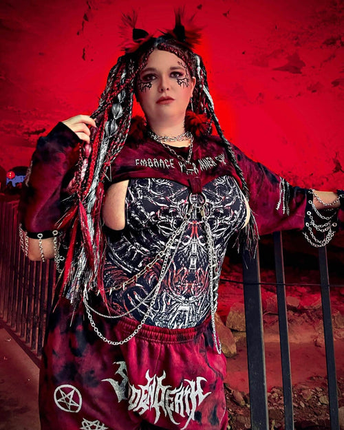 Gothic rave bodysuit in Darkness Temptation print with skeletal design, festival outfit styled with chains and dramatic makeup