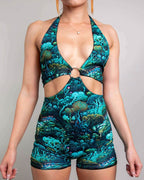 Teal Faewood rave bodysuit romper with cutout waist detail and O-ring hardware front view