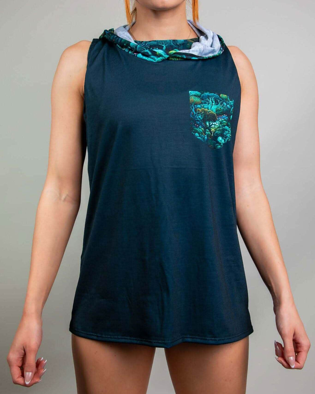 Rave bodysuit style Faewood hooded tank top in teal with mystical forest print - festival outfit front view