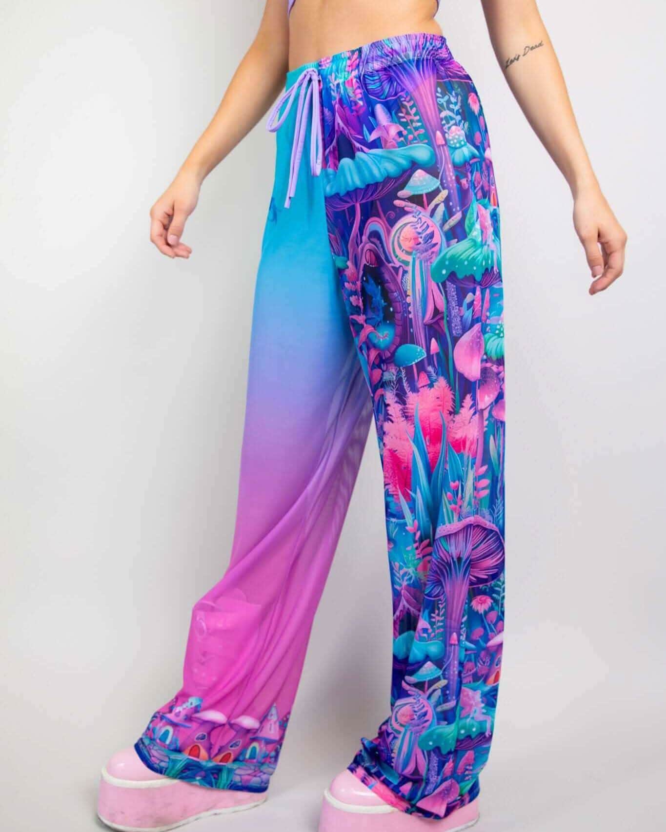 Fairycore Mesh Lucy rave bodysuit pants in purple pink gradient with tropical print front view festival outfit