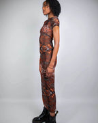 Brown fossil print mesh maxi dress rave bodysuit styled with black boots, side view festival outfit