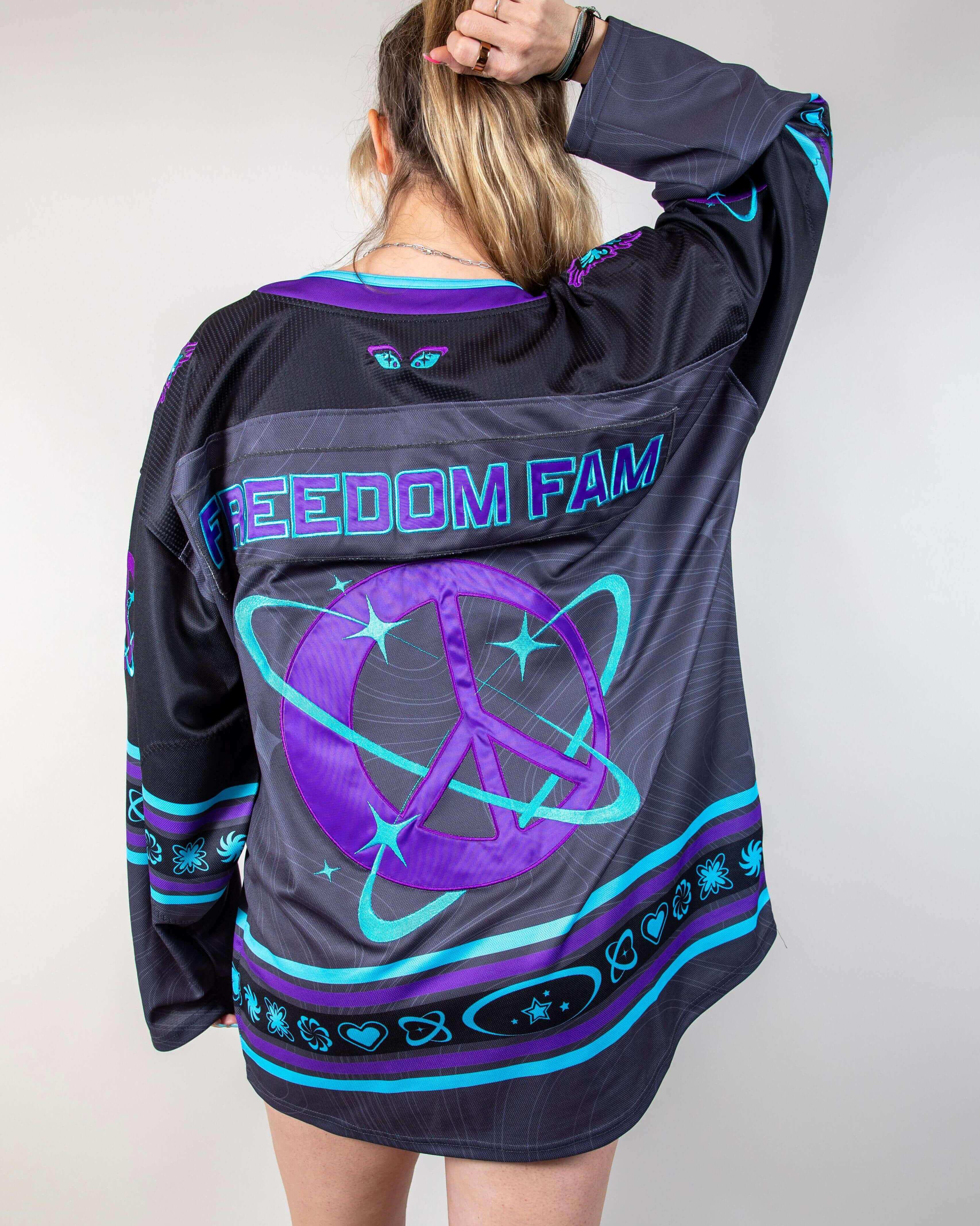 Rave bodysuit style Freedom Fam hockey jersey in purple and teal, back view festival outfit