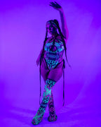 Intensity Cross Faded Bodysuit Set glowing under UV light, front view, perfect for rave festivals
