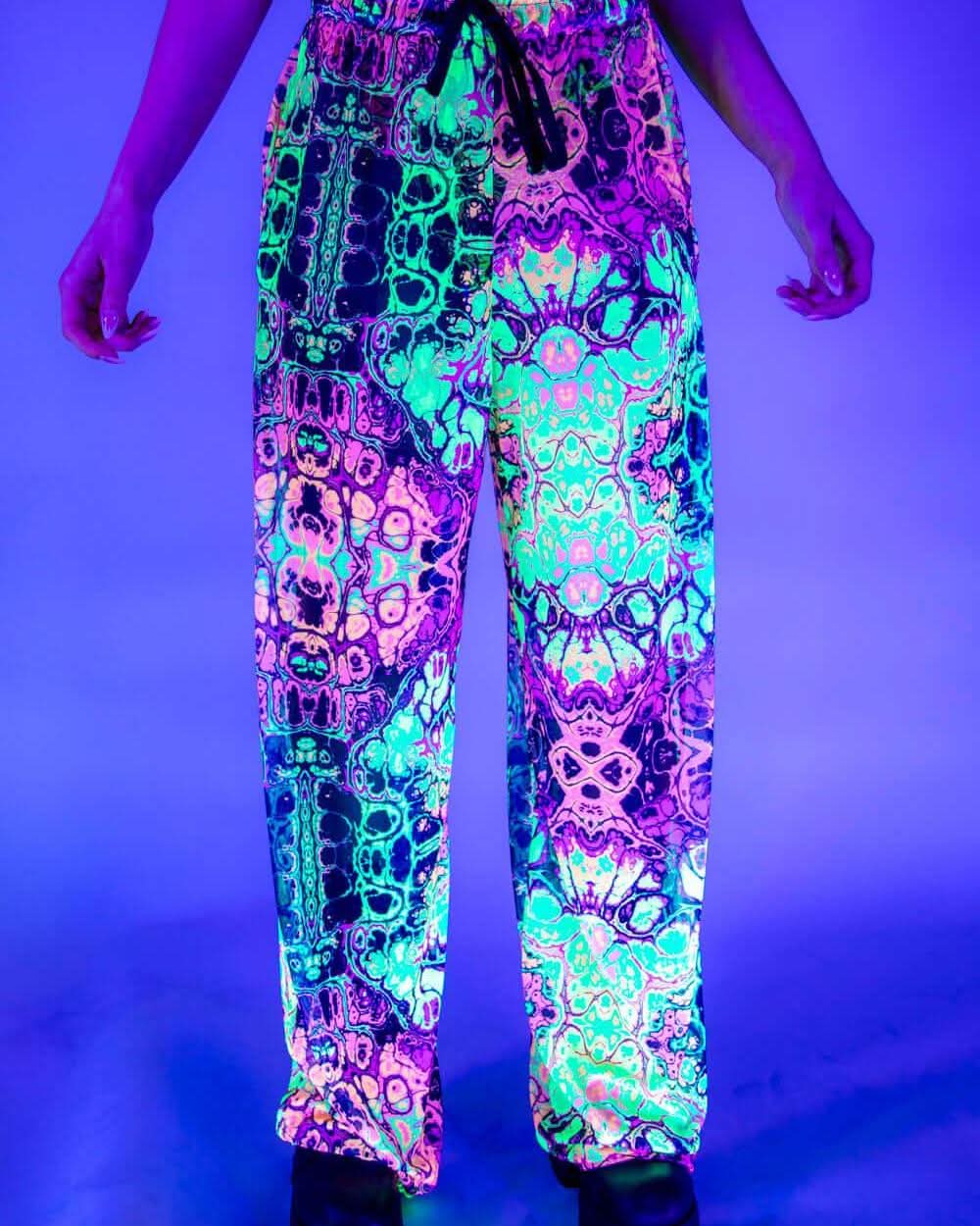Rave bodysuit style Intensity Mesh Lucy pants in neon green pink festival outfit under blacklight