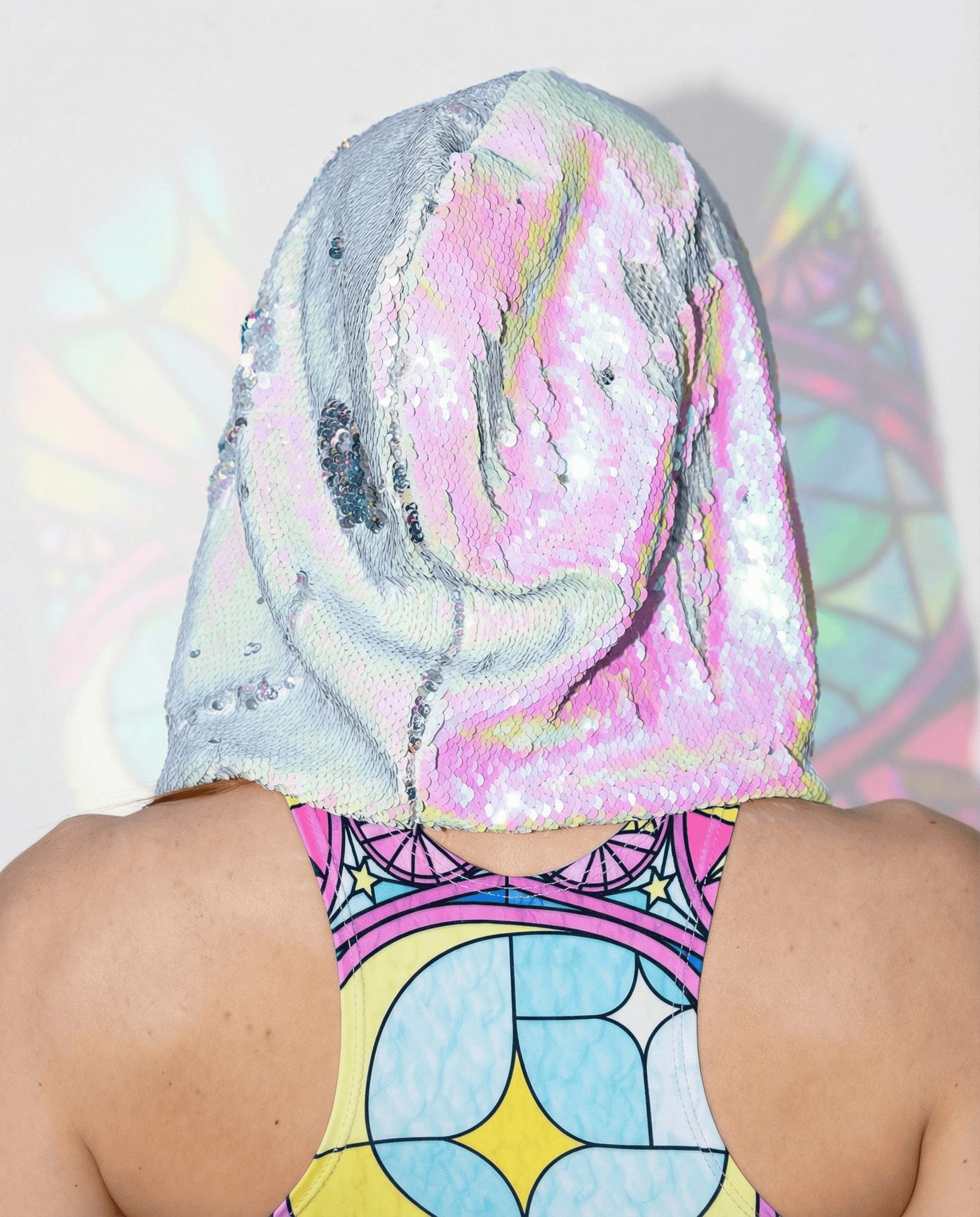 Back view of rave bodysuit with Moonlight sequin hood, iridescent pink and silver sequins, festival outfit styling