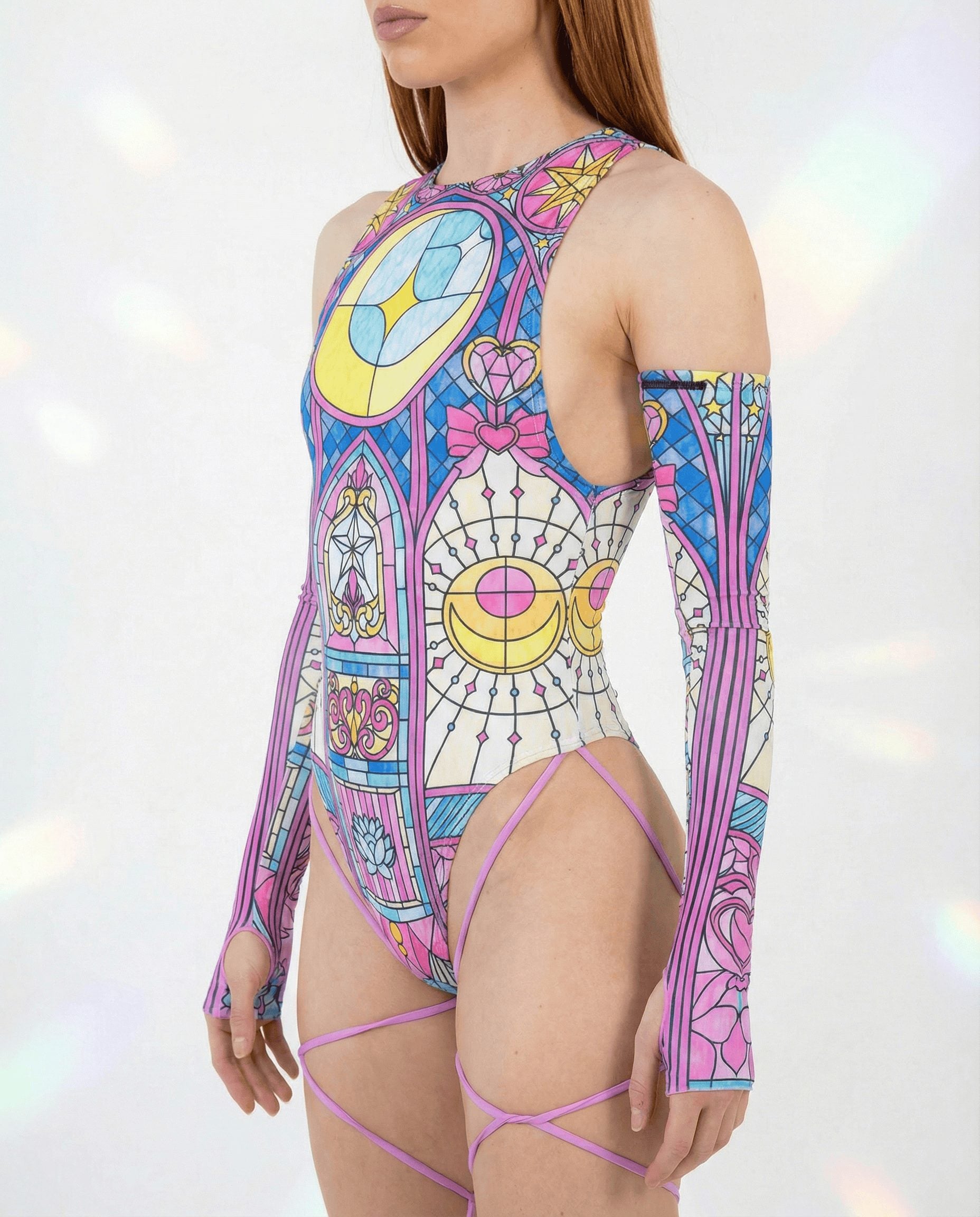 Rave bodysuit in Moonlight stained glass pattern with sideboob cutouts and purple leg straps, festival outfit side view