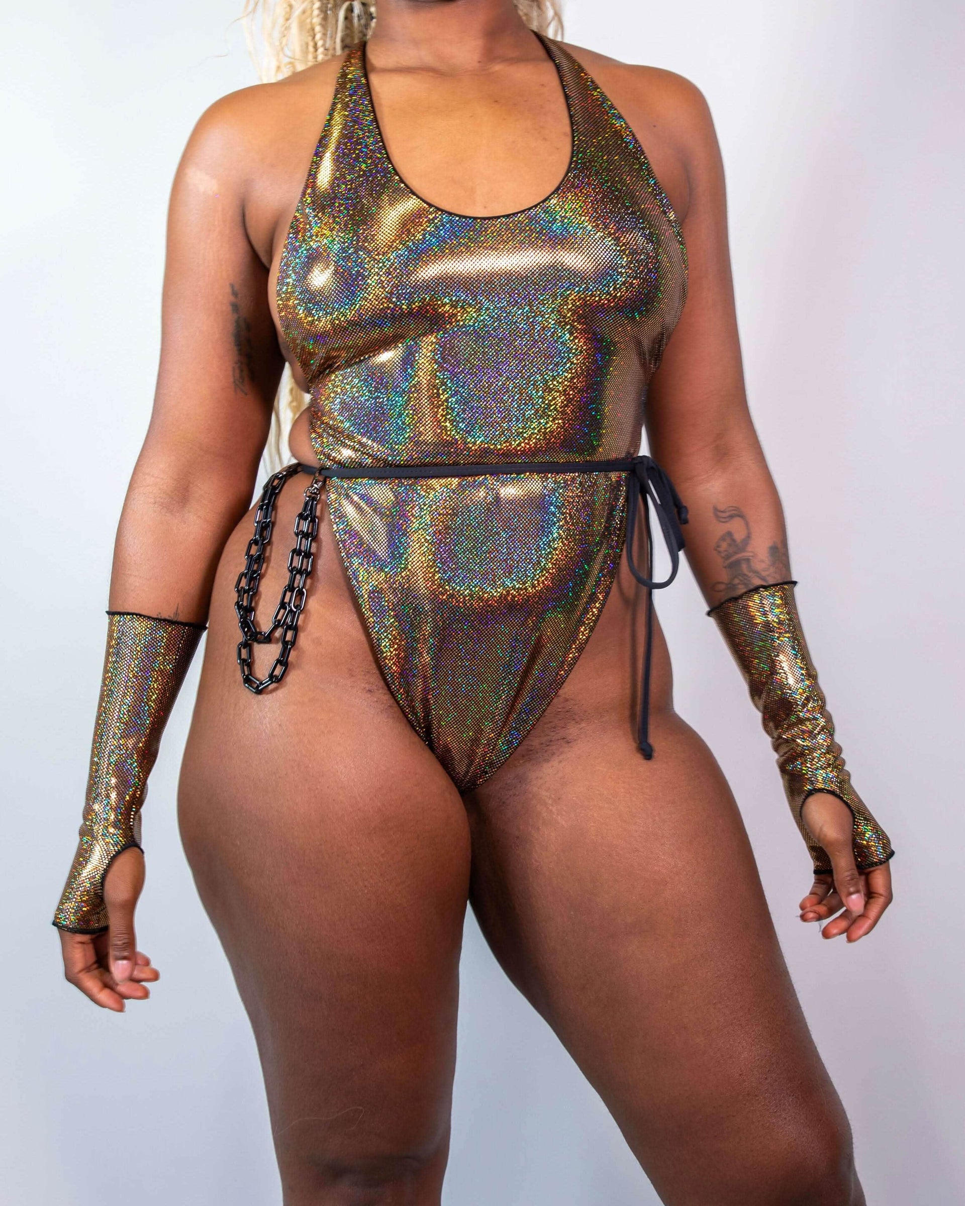 Starfire Temptation Cheeky One Piece rave bodysuit in holographic gold, front view, with matching arm sleeves.