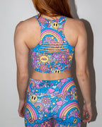 Groovy Slit Crop Top back view, featuring colorful psychedelic patterns, horizontal slits, and matching rave leggings.
